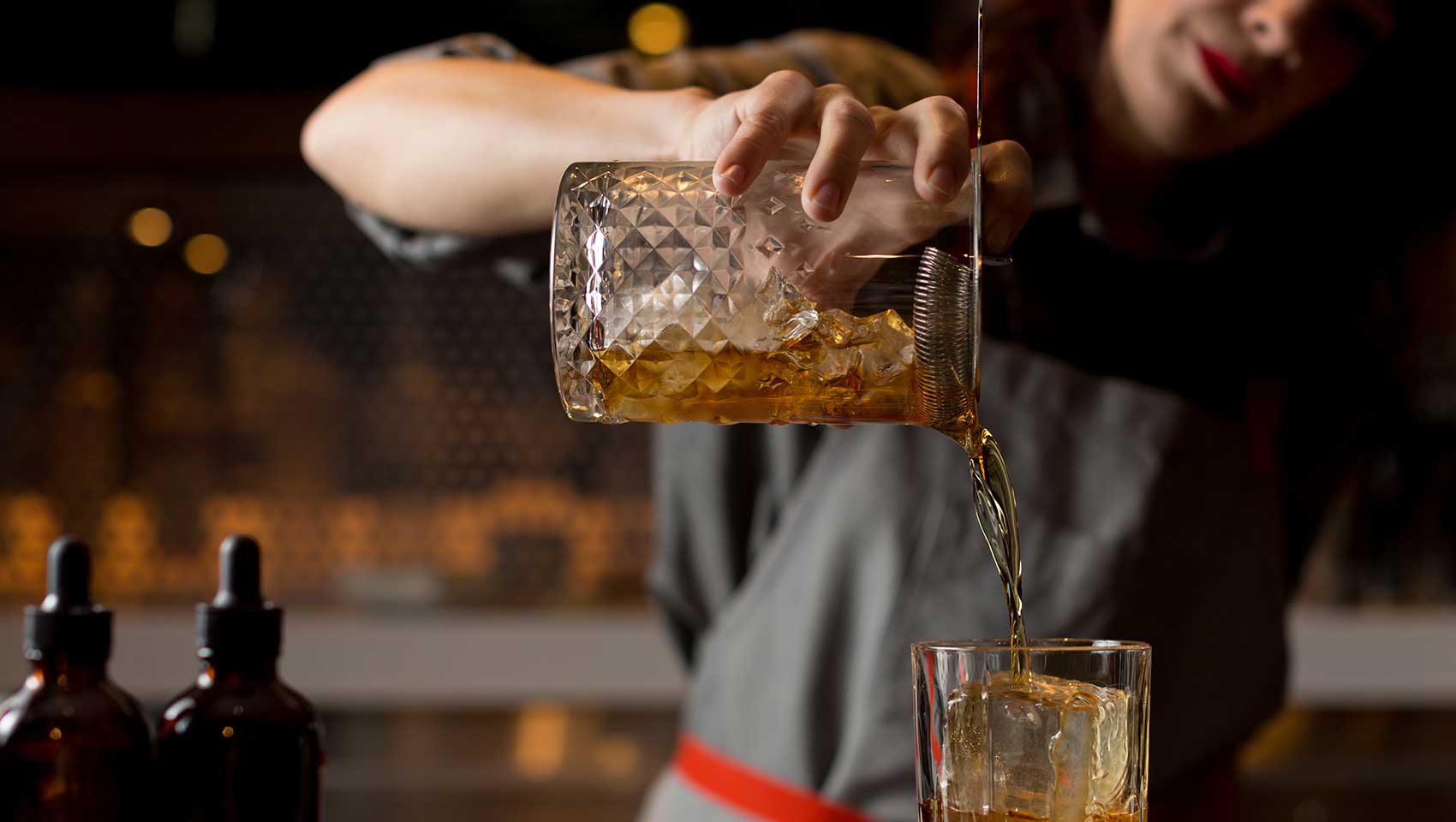 los angeles hotel bartender pouring cocktail