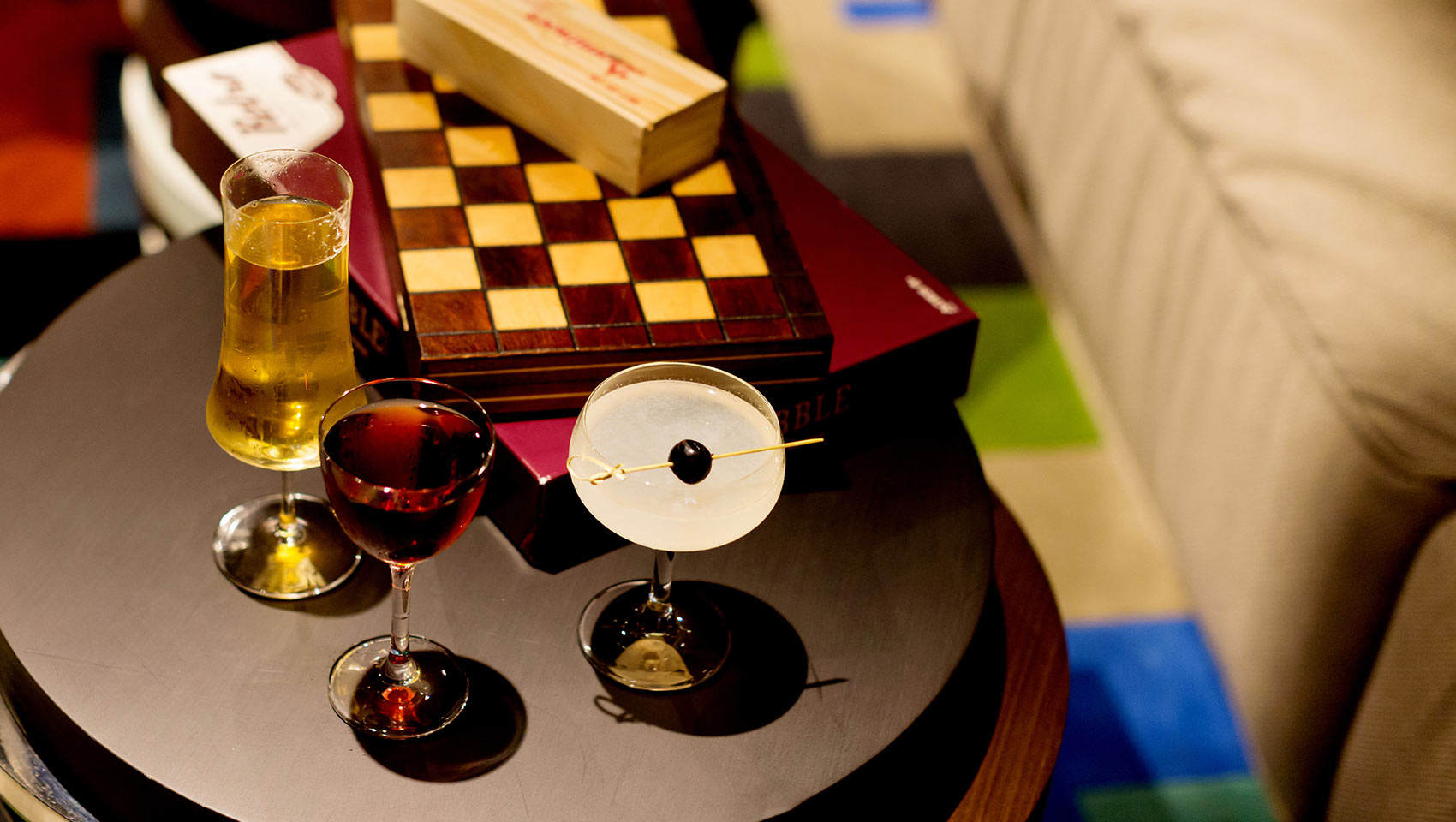 Close up of boardgames and cocktails in the game room of Kimpton Hotel Palomar Belverly Hills