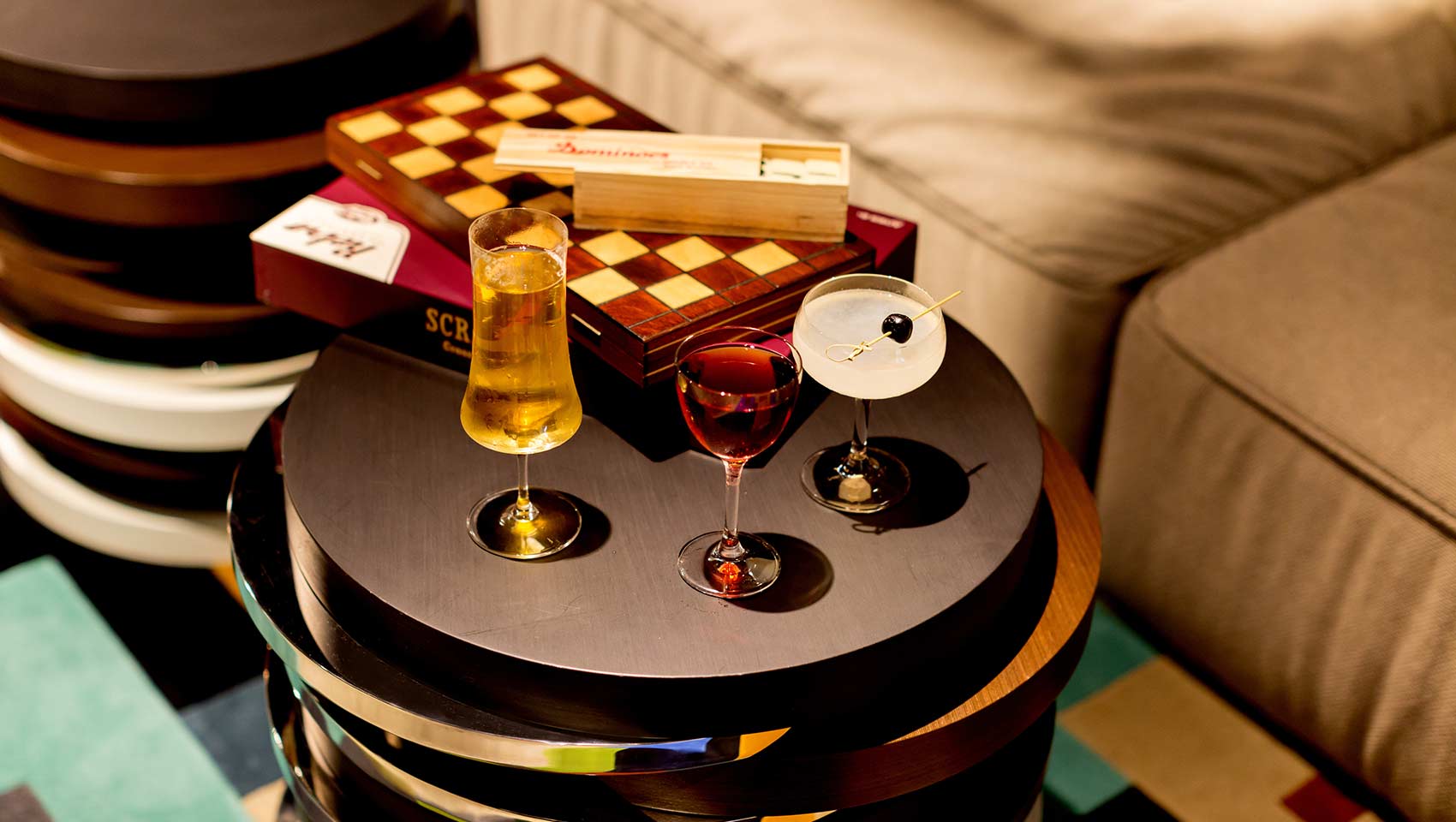 Close up of boardgames and cocktails in the game room of Kimpton Hotel Palomar Belverly Hills